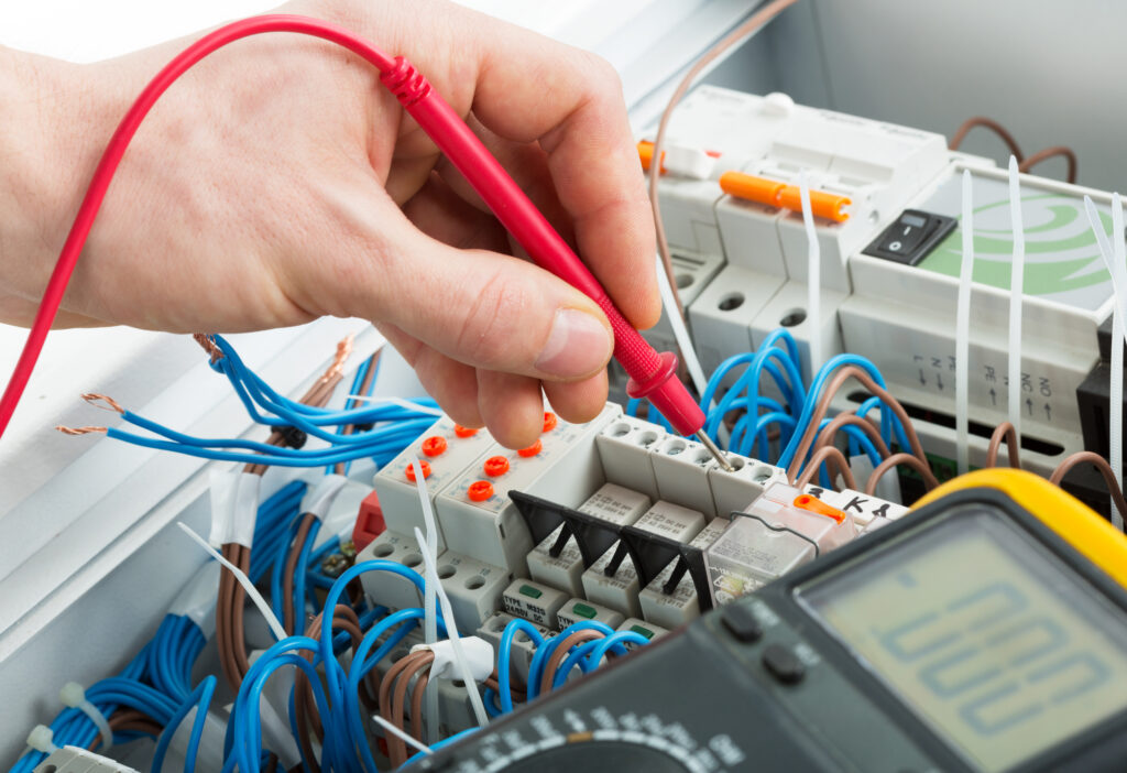 Expert Commercial Electrical Installations by Phase Electrical in Guildford hand of an electrician 29993559